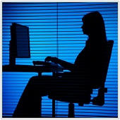 silhouette of woman working on computer